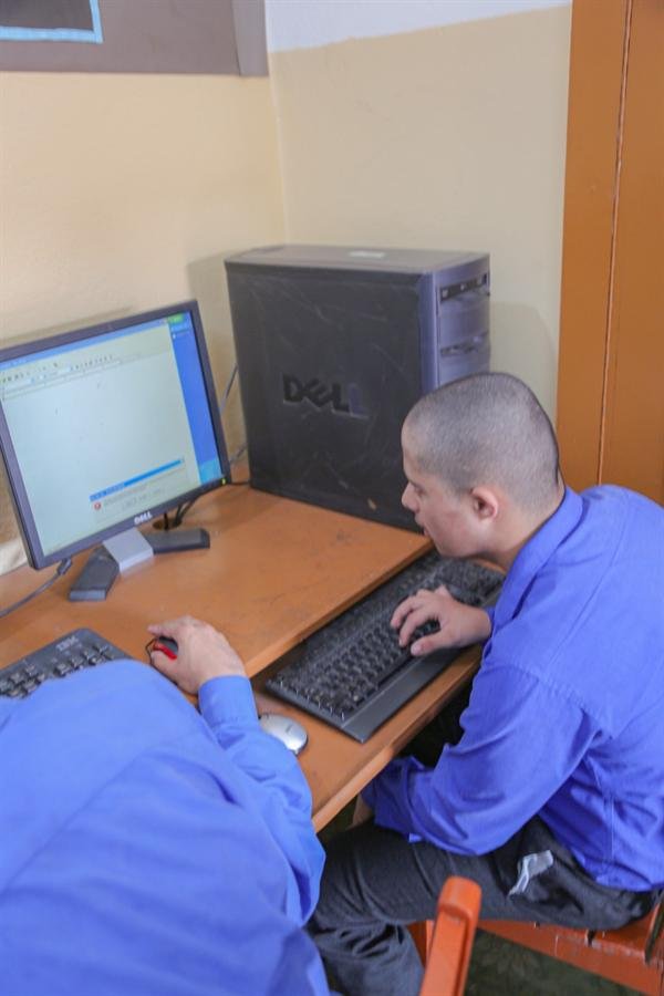 Students using a computer at a desk
